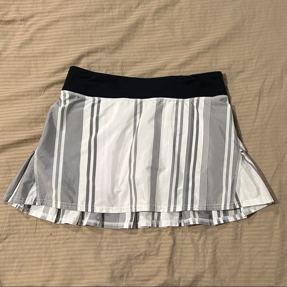Lululemon skort grey and white striped with Black Waistband.  Perfect condition.